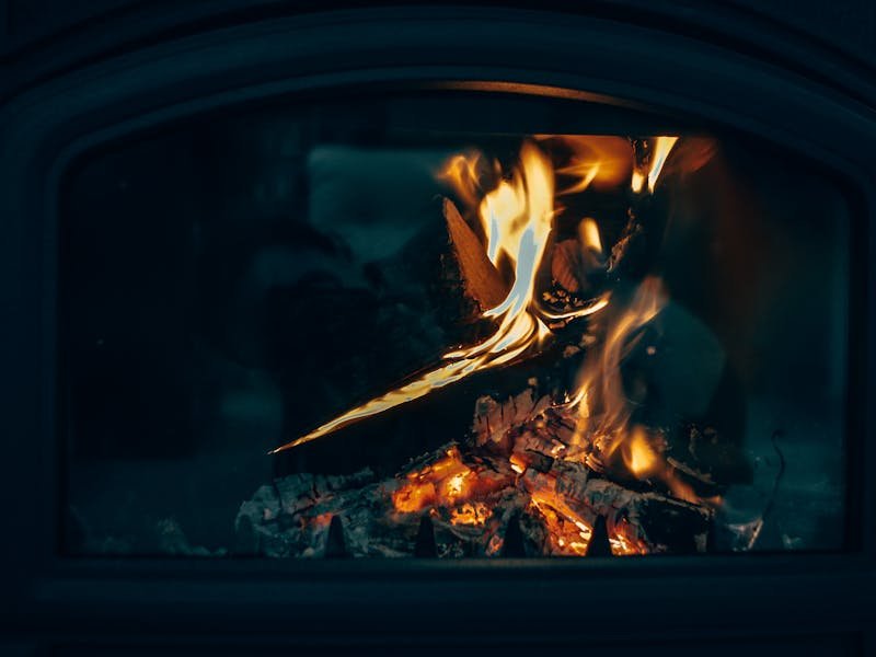 Modern wood stove interior with deep amber glow
